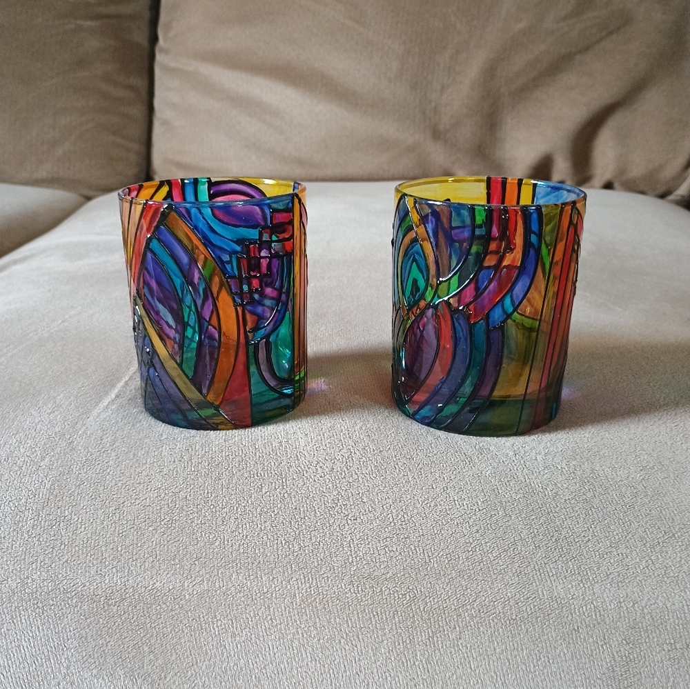 Set of 2 stained art glass candle holders.